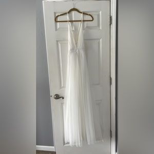 White low cut dress with layer of tulle